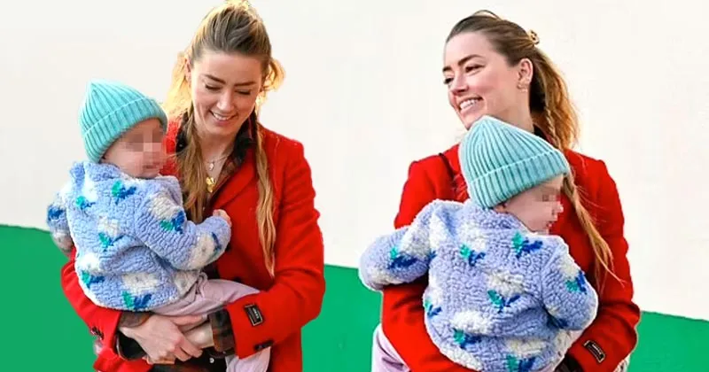 Gaya Amber Heard Gendong Anak saat Jalan-Jalan di Madrid